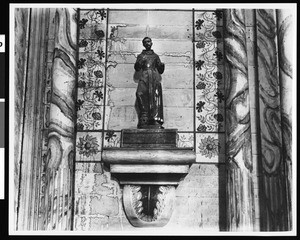 Statue of Franciscan saint, to the left of the Mission San Miguel Arcangel altar