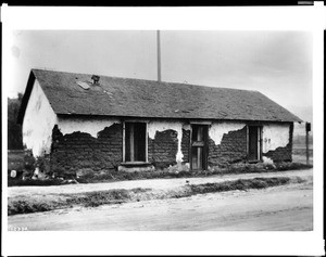 Exterior view of the Cota Adobe showing signs of disrepair in Old Town, San Diego, ca.1925