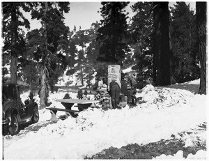 Group of campers cooking at an outdoor grill at Big Pines Camp, ca.1928