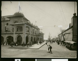 People walking near the State of California Building and the Pavilion near the Redondo Beach Pier, ca.1900