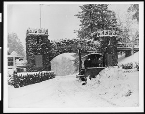 The entrance of Big Pines Camp showing a snow plow, ca.1930