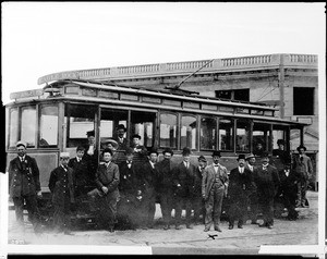 People standing in front of the first electric streetcar over the Eagle Rock route on the Glendale Electric Line, March 27, 1909