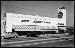 Exterior view of The Food Spot at Florence Avenue and Van Ness Avenue from across the street, ca.1940