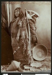 Indian woman with her papoose on her back, ca.1880-1920