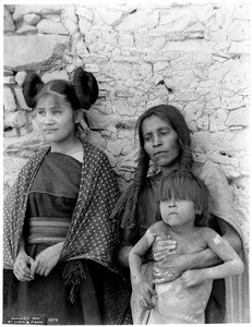 Hopi Indian woman and her daughter and son in the village of Oraibi, ca.1901