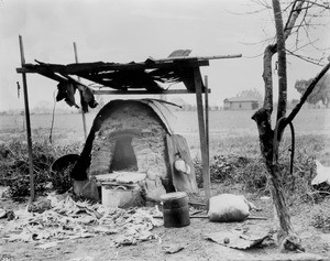 Outdoor oven on Ninth St. near the river, 1889