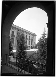 Exterior view of a building at the California Institute of Technology in Pasadena from under an archway, June 11, 1929