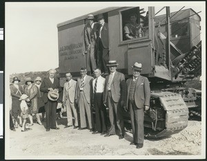 Construction site with a bulldozer, guests, and officials, ca.1935