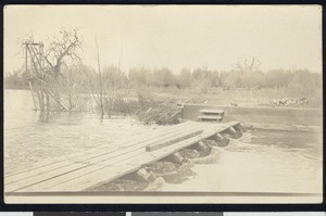 Wooden flood-control device on a river, ca.1910