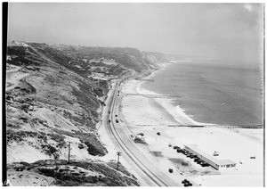 Birdseye view of three piers near Pacific Coast Highway between Santa Monica and Malibu