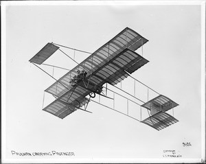 Louis Paulhan flying with a passenger (Mrs. Dick Ferris?) in his Henry Farman biplane, at the Dominguez Field Air Meet, Los Angeles, January 1910