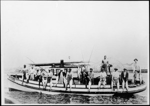 Portrait of fourteen fishermen with their catch for the day on a boat off Redondo Beach, ca.1905