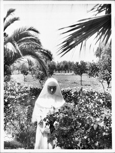 Dominican sister in the garden at the convent at Mission San Jose de Guadalupe, ca.1906