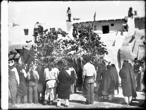 Acoma Indians in front of the outdoor altar at the Fiesta de San Esteban, Acoma Pueblo, 1886