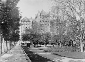 View of Pershing Square looking north on Olive Street, showing the Auditorium Building, Los Angeles, ca.1920