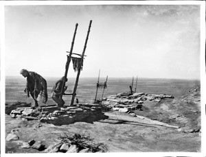 Hopi Indian priests emerging from their Kivas before the Hopi Snake Dance Ceremony at Mishongnovi, ca.1900