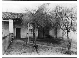 Old bell and cannon at Mission San Miguel Arcangel, before 1909