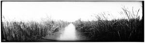 Panoramic view of a narrow irrigation canal in the Imperial Valley