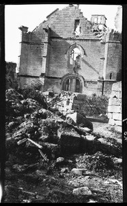 View of a pile of rubble outside the remains of a building in France, ca.1916