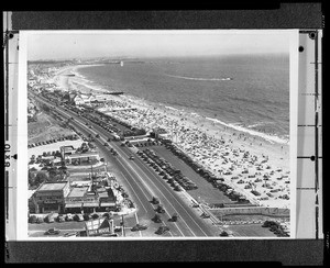 Birdseye view of Santa Monica, looking south along the coast from the Palisades toward the Venice Pier, 1938