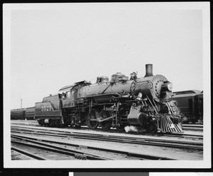 Unidentified locomotive engine at a railroad yard, ca.1920