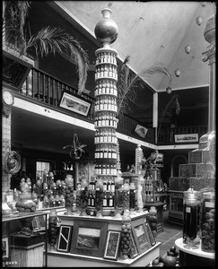 The "Pomona Tower of Fruits and Vegetables" being displayed in the exhibit room at the Los Angeles Chamber of Commerce building, 1902