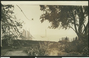 Two men watching sailboats on the sea, perhaps at Santa Barbara, ca.1930