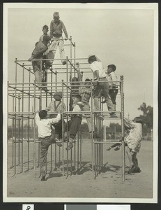 Children on playground equipment at Exposition Park Playground, June 1927