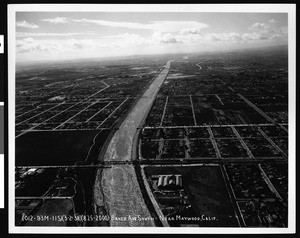 Aerial view of the flooded Los Angeles River at Baker Avenue South near Maywood, 1938