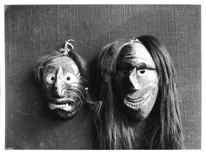 Two Alaska Iroquois Indian masks on display, ca.1900