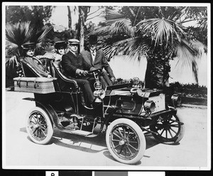 Driver Herbert C. Brown and Auto Vehicle Company Secretary R. F. Burnham in two-cylinder Tourist automobile, 1904