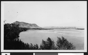 Wide Colorado River wending through desert terrain, April 14, 1934