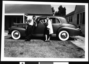Family with their first postwar new car, ca.1947