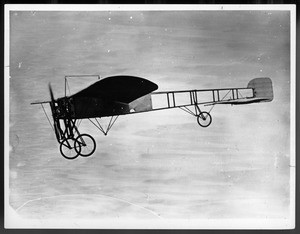 Louis Paulhan flying his monoplane (Bleriot?) at the Dominguez Field Air Meet, Los Angeles, January 1910