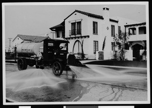 Department of Public Works street washing truck at work