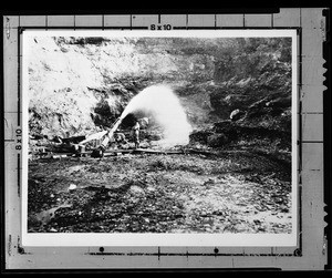 A miner using hydraulic mining techniques and tools to mine, Nevada City, California, ca.1900-1930