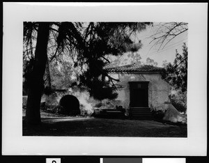 Exterior view of the front entrance of the old mill at Mission San Gabriel, ca.1890