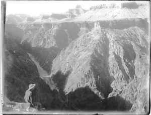 Berry, the "trail blazer" looks down on the Colorado River from Grand View Plateau, Grand Canyon, 1900-1930