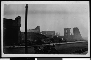 Earthquake damage in Inglewood, showing row of destroyed structures near a road, June 1920