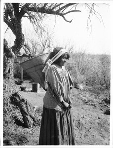 Apache Indian woman carrying a "Kathak" on her back, Arizona, ca.1880