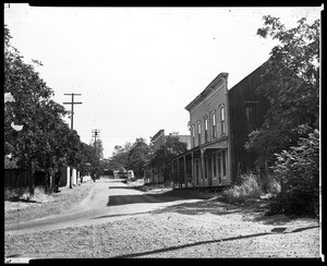 Buildings along a dirt road in Chinese Camp, California, ca.1930