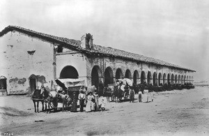 Wagon travelers in front of the Mission San Fernando Rey de Espana, ca.1900