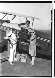 Inauguration of the Air Express Service, showing a woman and two pilots, August 31, 1927