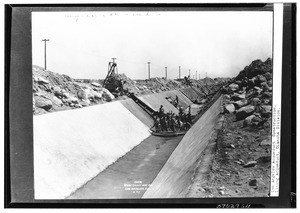 Construction workers lining an aqueduct of the Olanch Division, Los Angeles