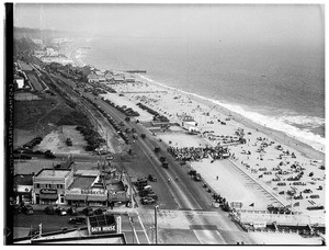 Large crowd of people on the beach near Pacific Coast Highway