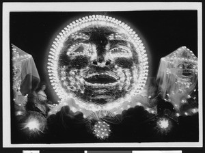 Illuminated faces in Shriner's electrical parade float, ca.1910