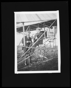 Aviators Frank H. Johnson and Glen Curtiss with a Curtiss biplane at the Dominguez Hills Air Meet, 1910