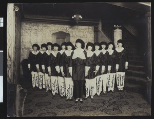 Ushers(?) lined in a V-formation inside the San Diego Pantages Theater, 1925