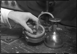 Man holding an unidentified scientific device