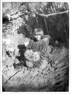 Portrait of an Apache Indian woman basket maker, ca.1900